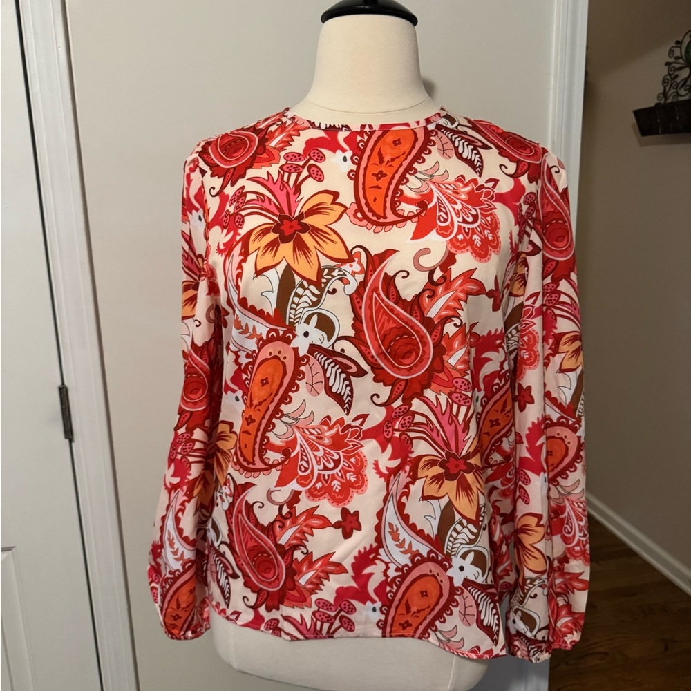 Brand unknown. Size XXL. Orange and white paisley- button back.
